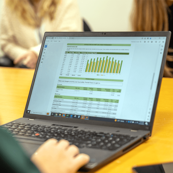 Laptop showing Budderfly's measuring and billing dashboard.