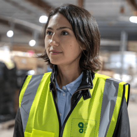 Woman in a Budderfly work vest.