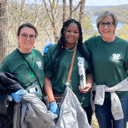 Budderfly team members smiling in the woods.